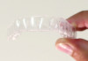 Fig 1 Clear orthodontic aligners manufactured in dental laboratories (images courtesy of Orthodent Laboratory).